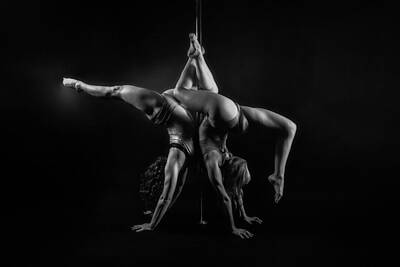 Athletes Photos - Entwined Inverted and Black and White by Monte Arnold