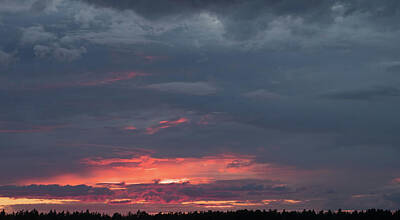 Abstract Skyline Photos - Evening landscape with a setting sun and black clouds by Alexey Larionov