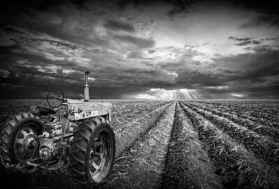 Randall Nyhof Royalty-Free and Rights-Managed Images - Farmall Tractor with Field Furrows and Sunburst Sky in Black and by Randall Nyhof