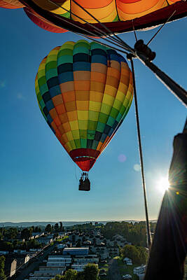 Surrealism Rights Managed Images - Flying hot air balloon with sunburst Royalty-Free Image by Dan Friend