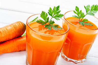 Staff Picks Rosemary Obrien Rights Managed Images - Glasses of carrot juice Royalty-Free Image by Wdnet Studio