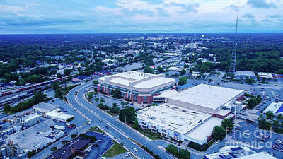 Raynor Garey Royalty-Free and Rights-Managed Images - Greensboro skyline on horizon above Coliseum by Raynor Garey