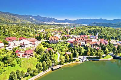 Celebrity Caricatures - Idyllic mountain town of Fuzine on Bajer lake aerial view by Brch Photography