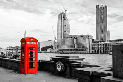 London Skyline Photo Rights Managed Images - London Phone Booth on the River Thames Royalty-Free Image by Aashish Vaidya