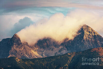Mountain Royalty-Free and Rights-Managed Images - Mountain peaks in clouds at sunset. Tatra Mountains, Poland by Michal Bednarek