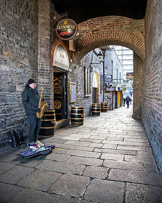Musicians Royalty-Free and Rights-Managed Images - Musician under Merchants Arch - Dublin by Barry O Carroll