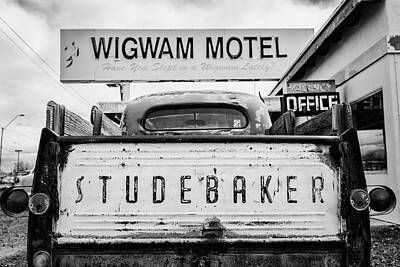 Travel Pics Rights Managed Images - Route 66 Wigwam Motel Studebaker Royalty-Free Image by Stephen Stookey