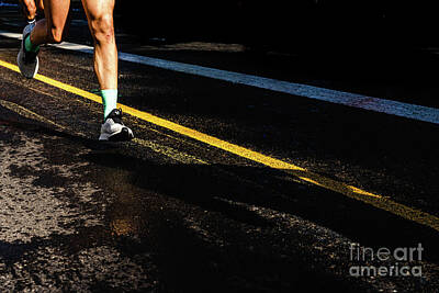 Athletes Photos - Running athletes have powerful quadriceps and calf muscles for r by Joaquin Corbalan