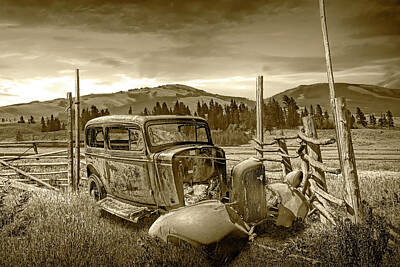 Randall Nyhof Royalty-Free and Rights-Managed Images - Sepia Tone of Junk Vintage Auto with Wood Fence in Western Lands by Randall Nyhof