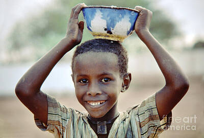 Beers On Tap - Smiling Boy in Somalia by Wernher Krutein