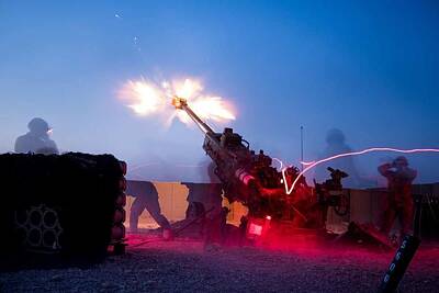 Owls - Soldiers fire a M777 towed 155 mm Howitzer by US Army by Timeless Images Archive
