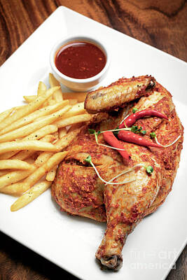 Michael Jackson Rights Managed Images - Spicy Portuguese Piri Piri Half Chicken With Fries On Plate Royalty-Free Image by JM Travel Photography