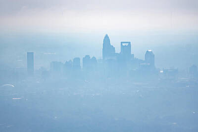 Abstract Skyline Photo Rights Managed Images - Sun rising early morning over charlotte skyline  seen from airpl Royalty-Free Image by Alex Grichenko