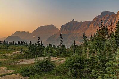 Fairy Tales Adam Ford - Sunset Mountain HDR - aerial photography of trees near mountain under blue sky - Glacier National Park by Julien