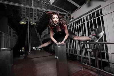 City Scenes Photos - Woman jumping split at night in the city by Felix Mizioznikov