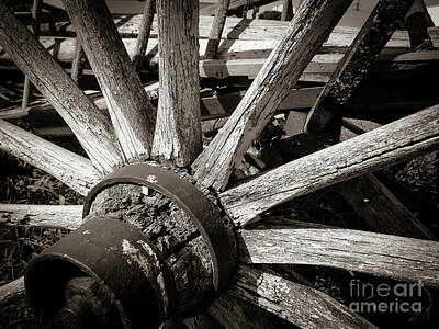 Black And White Rock And Roll Photographs - Wooden cartwheel by Ann Biddlecombe