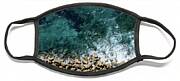 Aerial View From Flying Drone Of Crystal Blue Ocean Water And Sea Wall. Face Mask Aerial View From Flying Drone Of Crystal Blue Ocean Water And Sea Wall. Face Mask